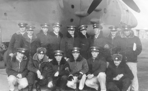 Crew of the 679th Regiment in front of their An-12PP electronic countermeasure (ECM) aircraft at Kambala airfield